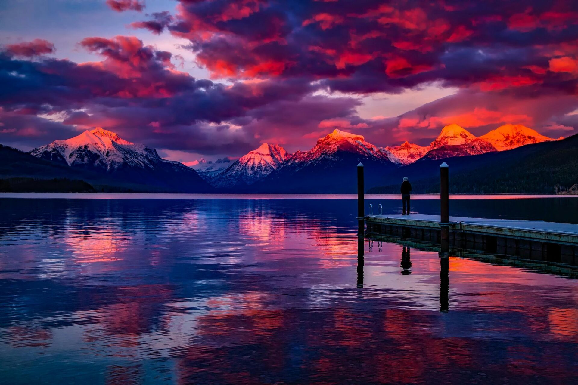 dock-under-cloudy-sky-in-front-of-mountain